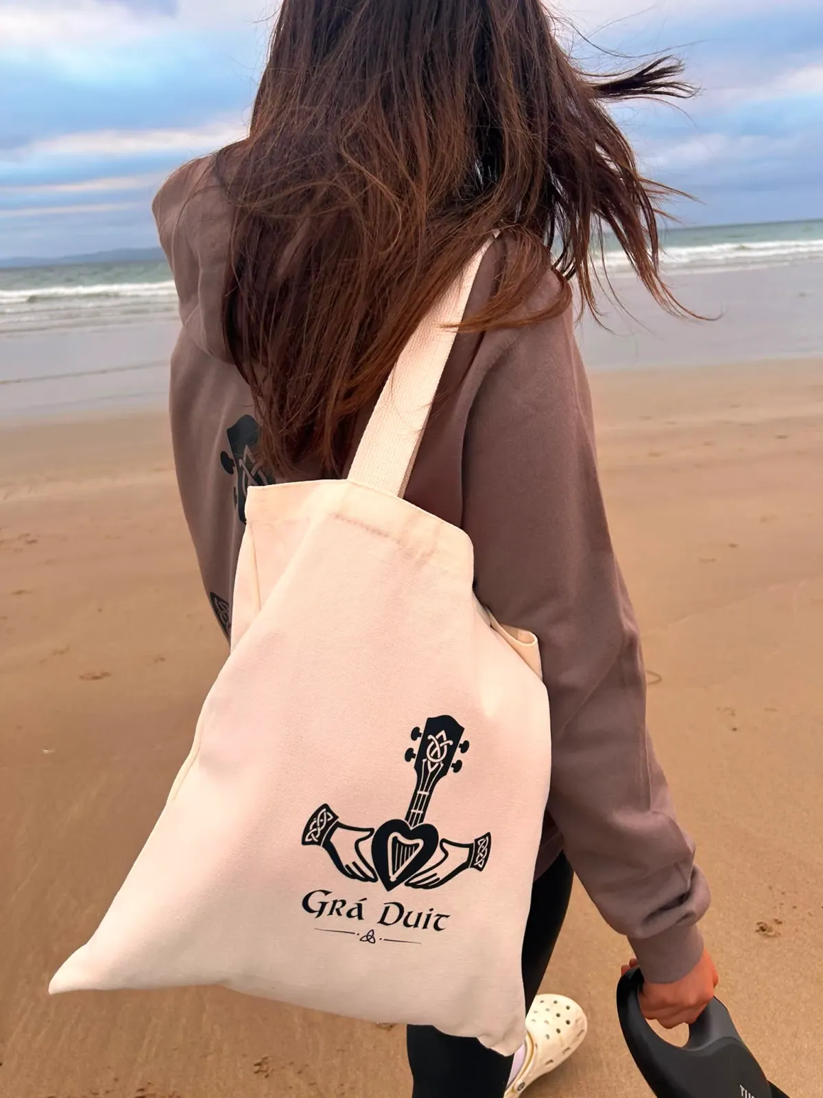 Hoodie and canvas tote on the beach